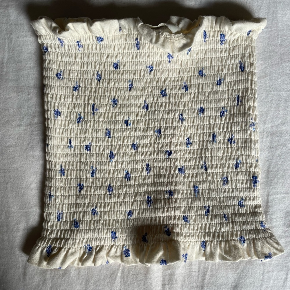 $3/15 NWOT. Shirred tube top with blue flowers on a beautiful cream. GORGEOUS!